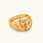 Additional angle of the 18K gold-plated stainless steel signet ring with ornate cross face and filigree scroll band.