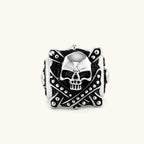 Silver-tone 316L stainless steel skull ring with crossbones, black enamel fill, studded details, and wide shank, 21mm top width.