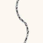 Men's antique silver Byzantine chain necklace, 6.2mm wide interlocking S-link pattern with ornate lobster clasp, 560mm length.