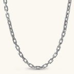 Silver 316L stainless steel rectangular link chain necklace with intricate scroll engravings, 560mm length, 7.1mm width.