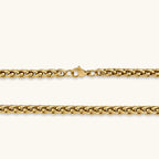 18K gold-plated stainless steel wheat chain necklace, 4.2mm wide, with lobster clasp, on off-white background.
