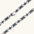 Additional angle of the oxidized silver stainless steel gothic-baroque chain necklace with navy CZ stones.