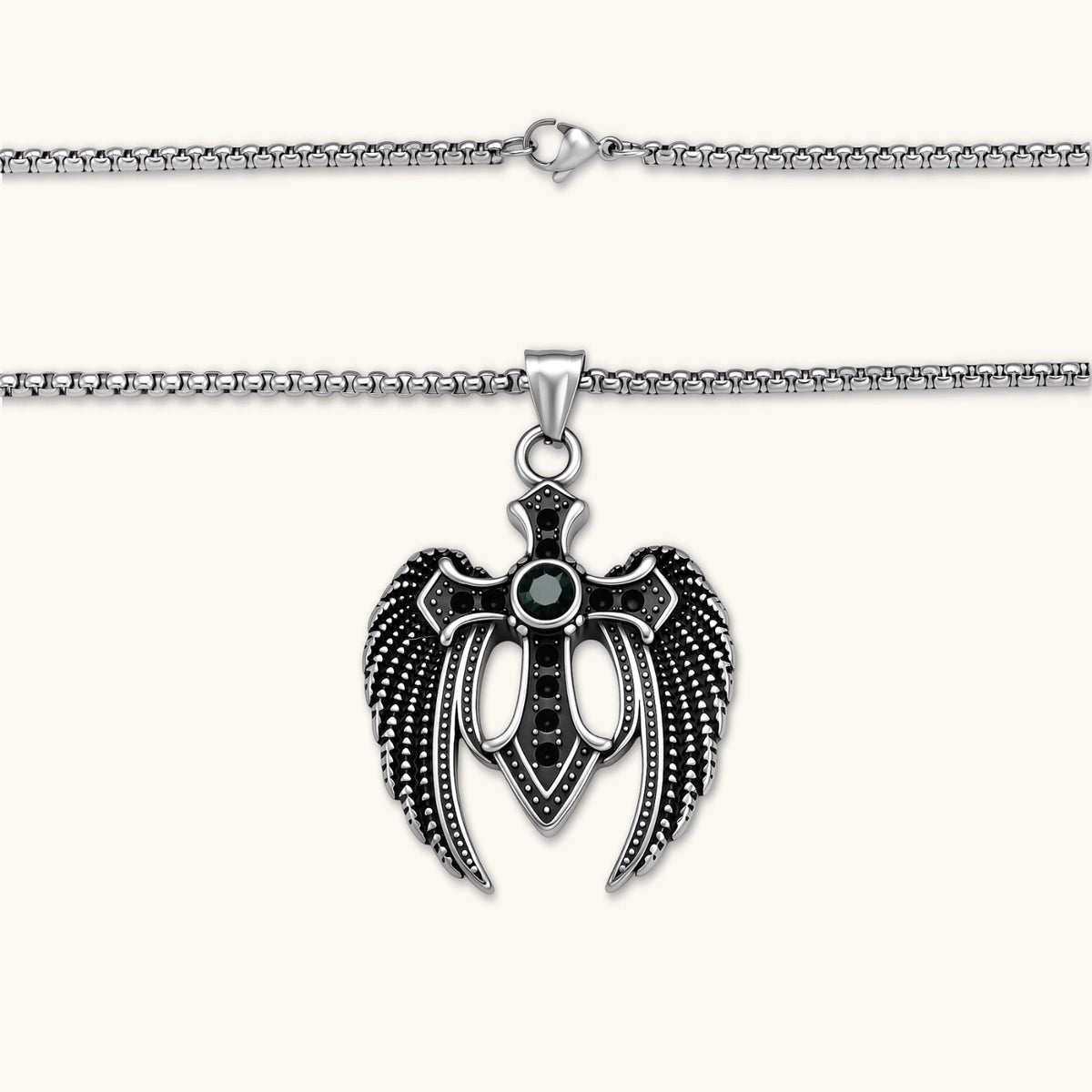 Additional angle of the silver stainless steel angel wing cross pendant with green CZ center stone and black crystals.