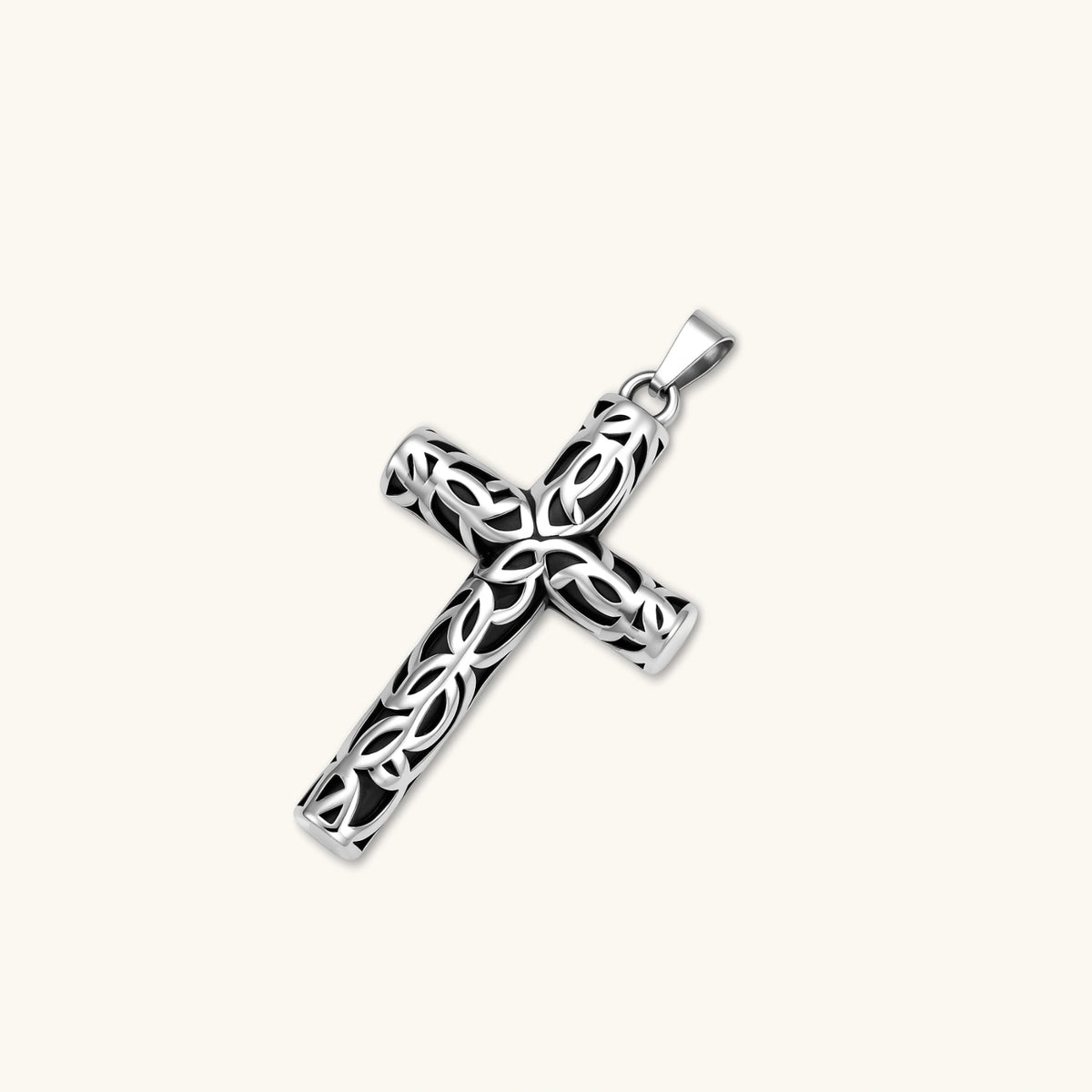 Close-up of the silver stainless steel Celtic cross pendant with filigree vine pattern on a box chain.