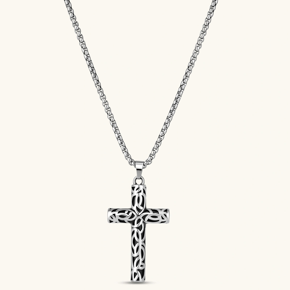 Front view of the silver stainless steel Celtic cross pendant with filigree vine pattern on a box chain.