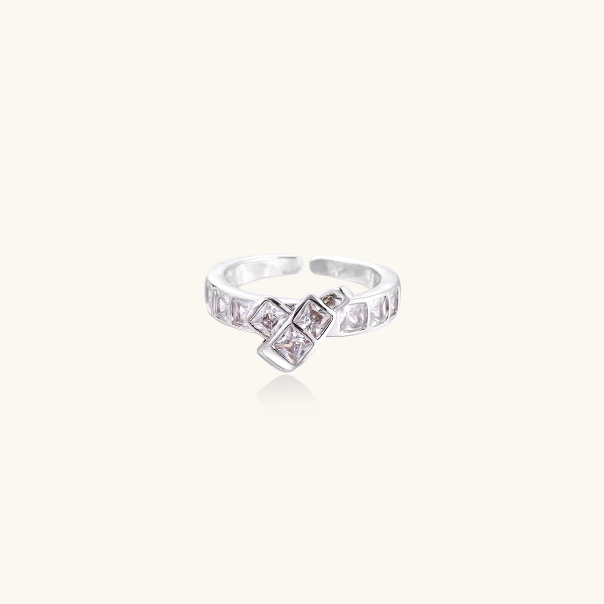 Alternate angle of the white gold-plated adjustable ring with stacked square zirconia stones.