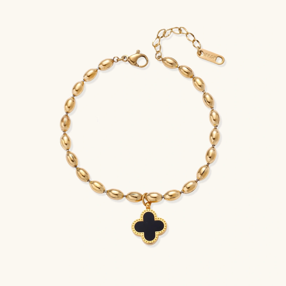 Alternate angle of the 18K gold-plated beaded bracelet with a four-leaf clover charm in mother-of-pearl or black enamel.
