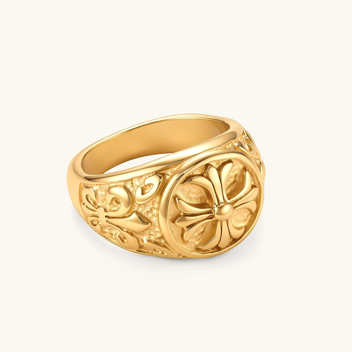 Additional angle of the 18K gold-plated stainless steel signet ring with ornate cross face and filigree scroll band.