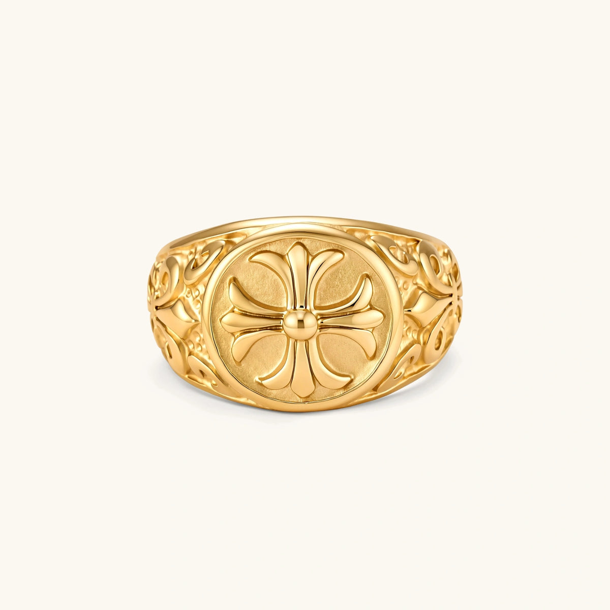 Alternate angle of the 18K gold-plated stainless steel signet ring with ornate cross face and filigree scroll band.