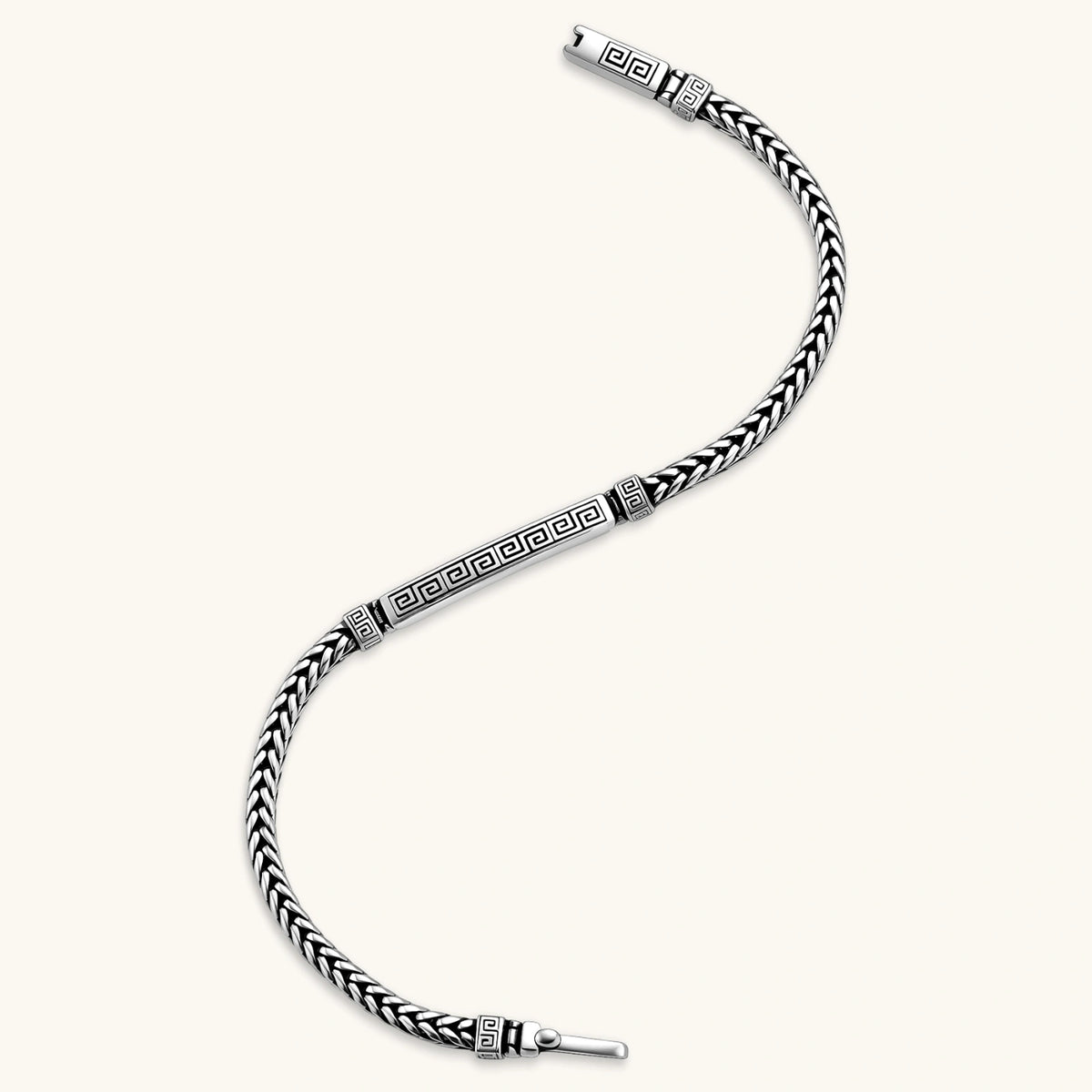 Close-up of the antique silver plated eco-brass foxtail chain bracelet with Greek key engraved bar.