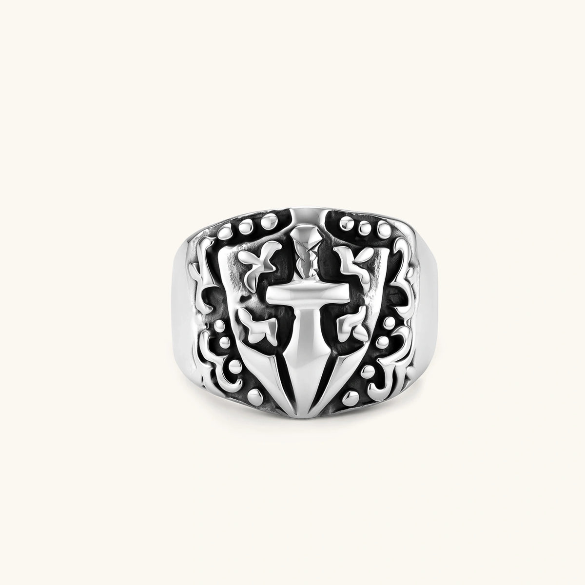 Additional angle of the stainless steel signet ring with raised knight shield and cross motif.
