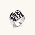 Front view of the stainless steel signet ring with raised knight shield and cross motif.
