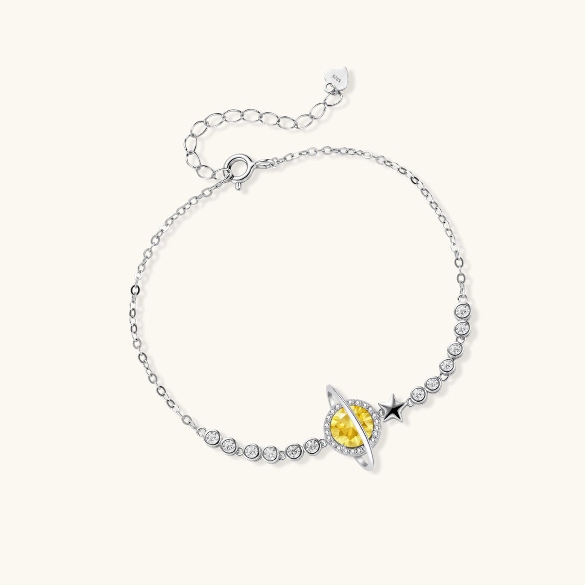 Alternate angle of the sterling silver bracelet with a yellow moissanite stone and a star charm.