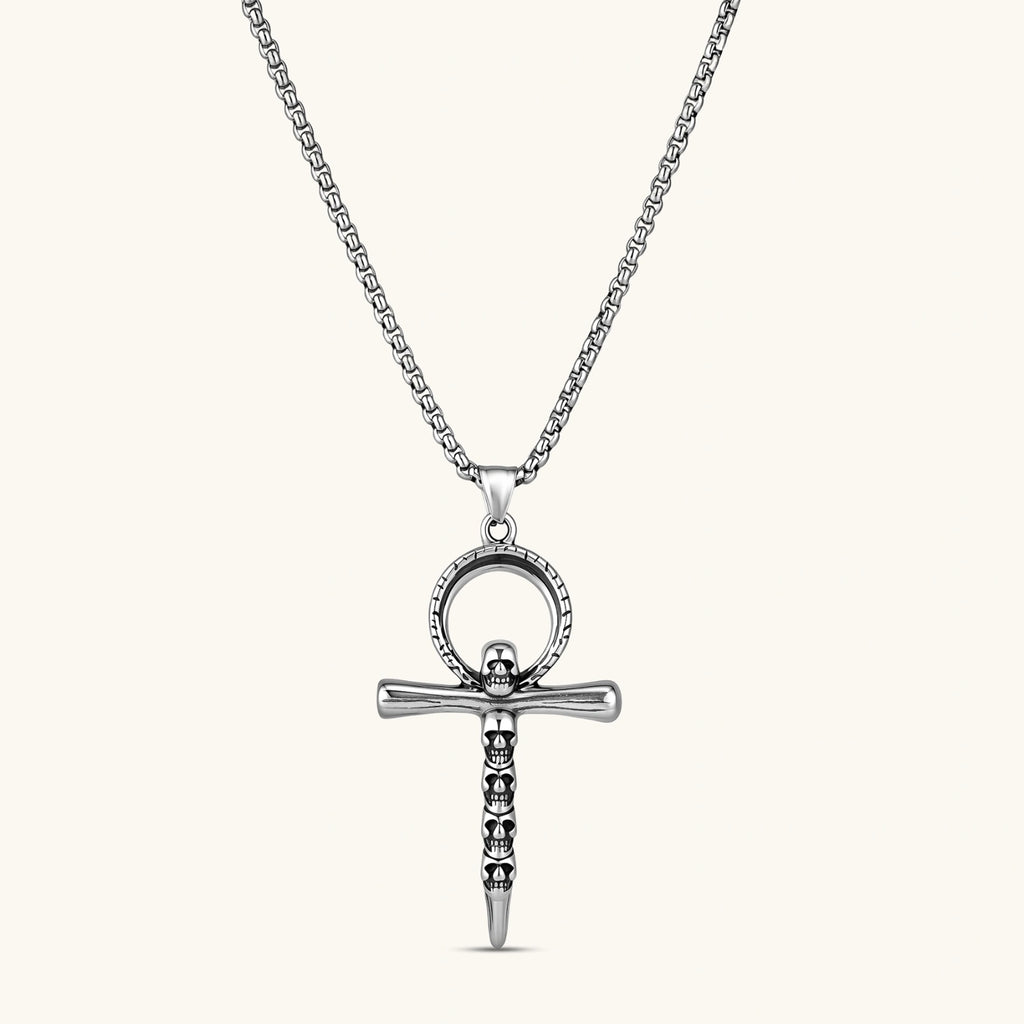 Front view of the stainless steel ankh pendant with skull motifs on a box chain necklace.