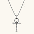 Front view of the stainless steel ankh pendant with skull motifs on a box chain necklace.