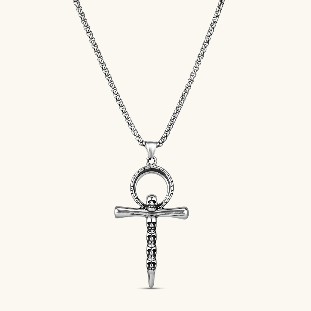 Front view of the stainless steel ankh pendant with skull motifs on a box chain necklace.